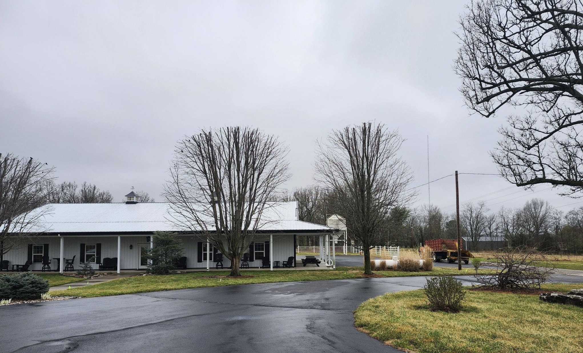 Trimmed trees in front of a country home